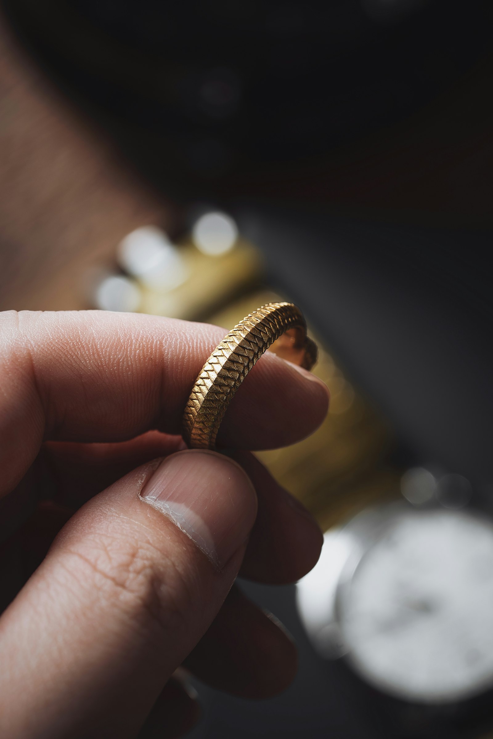 Examining a handcrafted gold ring
